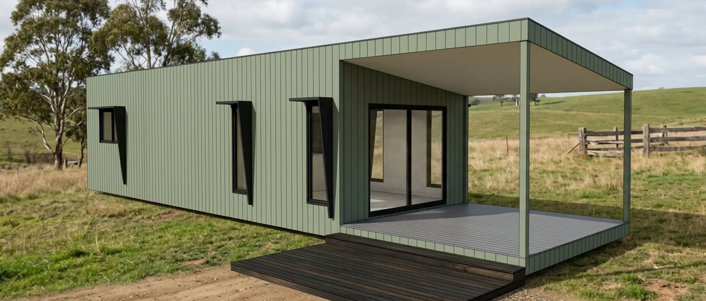 Render of the 1 bedroom King Suite in sage green steel cladding, with a covered deck, in a paddock with a timber fence.